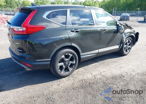 2018 Honda Cr-V Touring z USA, uszkodzony, nr VIN 7FARW2H91JE088570
